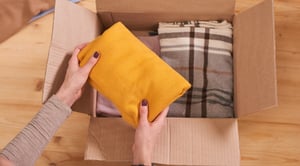Hands-placing-item-into-box-blog-image